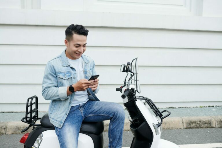 Moped Driver Communicating Online